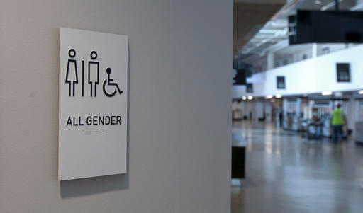 A sign marking an all-gender restroom is seen at the new Golden 1 Center in Sacramento, Calif.