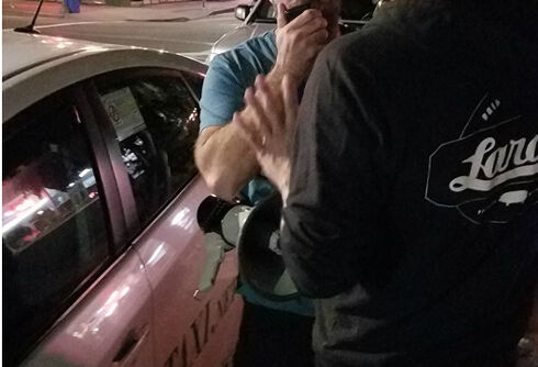 Cab company supports driver who yelled anti-gay slurs outside gay bar