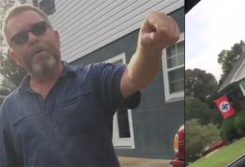 Watch this woman confront a man flying the Nazi flag outside his home