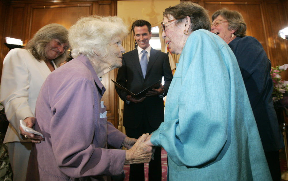 Del Martin, center left, and Phyllis Lyon, center right, are married by San Francisco Mayor Gavin Newsom ,center, in a special ceremony at City Hall in San Francisco, Monday, June 16, 2008. Also pictured are the couple's witnesses, Roberta Achtenberg, left, and Donna Hitchens. Lyon and Martin became the first officially married same sex couple after California's Supreme Court declared gay marriage legal.