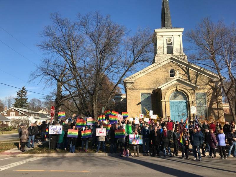 This guy saw 7 antigay protesters outside a church, so he called a few friends for help
