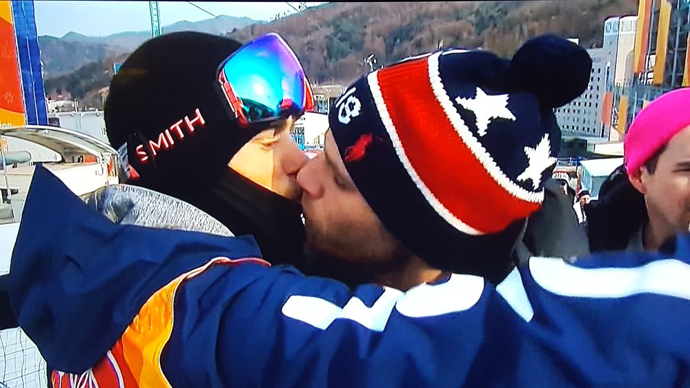 In historic first, Gus Kenworthy kisses his boyfriend at the Olympics
