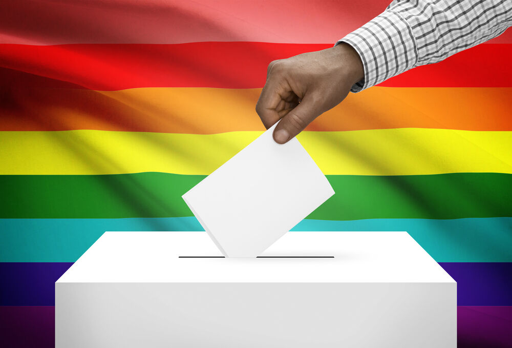 Ballot box with a rainbow background