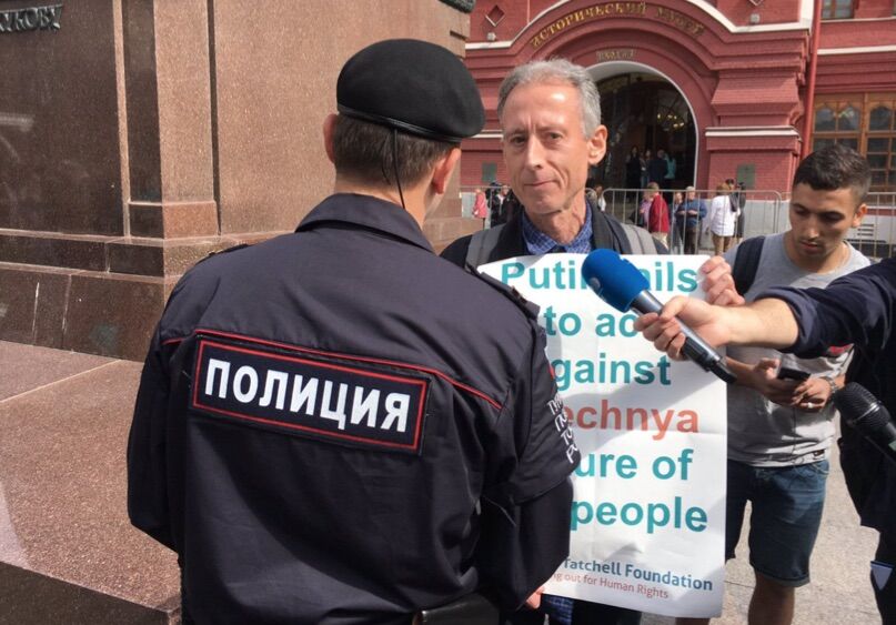 English activist and politician Peter Tatchell being arrested by Russian police during the World Cup.
