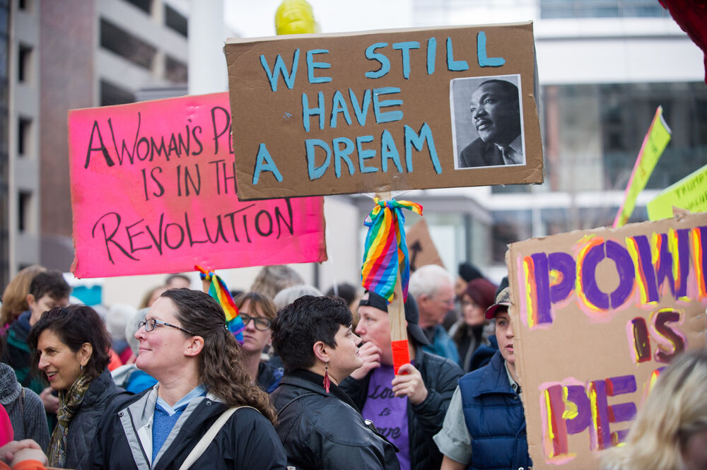 December 3, 2016: A participant in the Portland Women March Against Hate carry signs reading "We still have a dream"