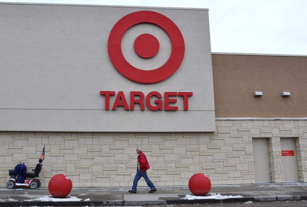 A man walks in front of Target store in Ontario Canada.