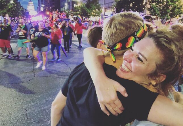 Jen Hatmaker gives a "mom hug" at Austin Pride