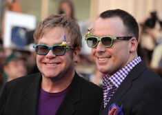 Elton John & David Furnish win lawsuit claiming dog left ‘Freddy Krueger-like’ injuries on a child