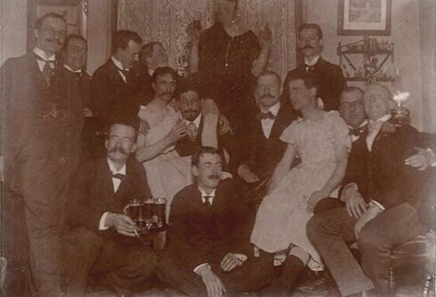 These men were having a gay old time at a party in the early 1900s