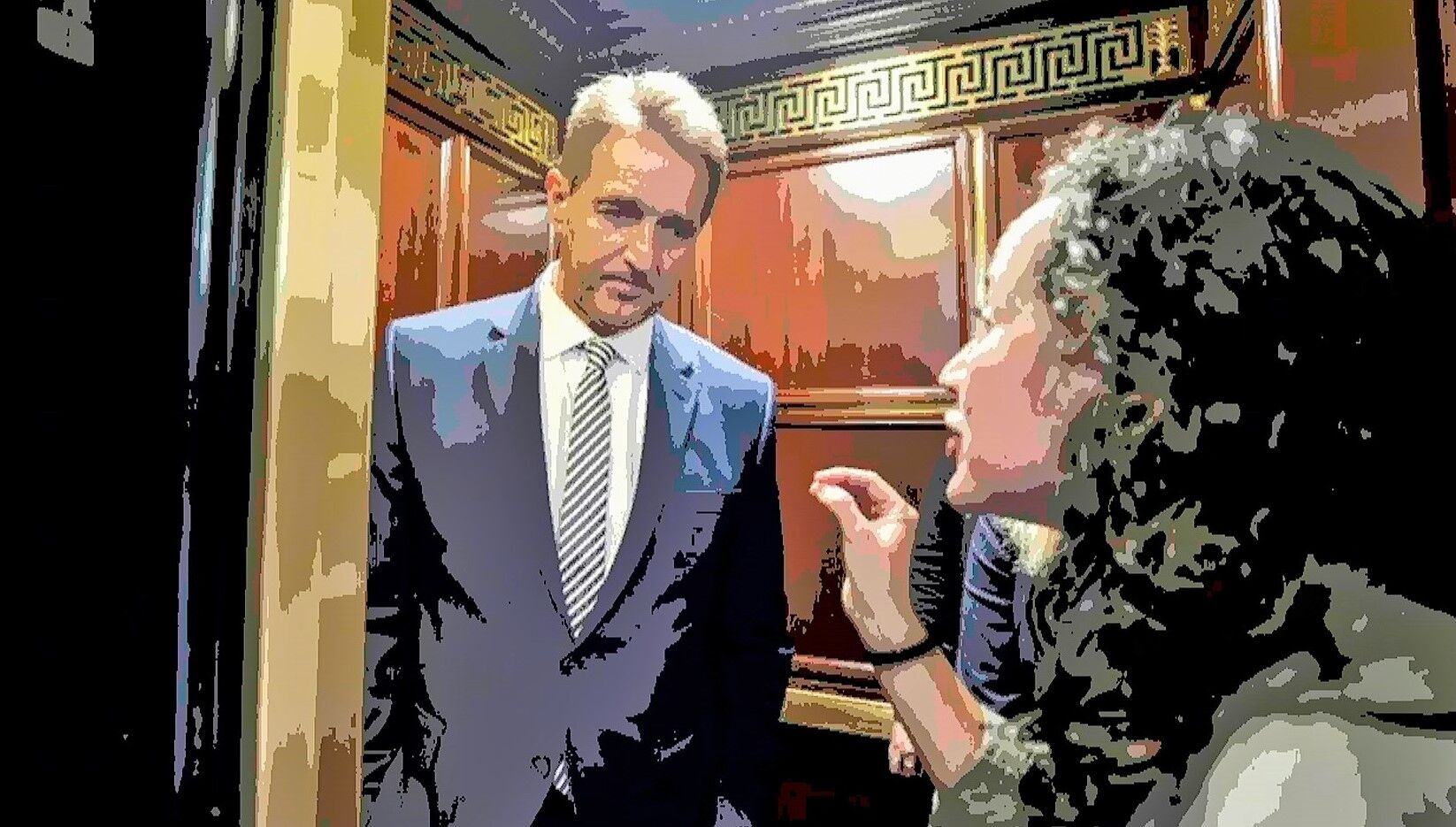 Republican Senator Jeff Flake is confronted in the elevator by a woman telling her story of sexual assault. Flake voted to confirm Brett Kavanaugh to the Supreme Court despite numerous allegations of sexual assault.