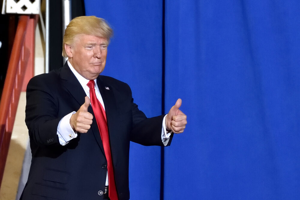 HARRISBURG, PA - APRIL 29, 2017: President Trump giving a two thumbs up gesture as he exits the stage of his campaign rally. Held at The Farm Show Complex and Expo Center.