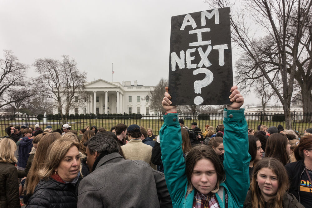 WASHINGTON, DC - FEB 19, 2018: Demonstrators in front of the White House protest the federal government's inaction on gun control following a deadly shooting in a south Florida high school.