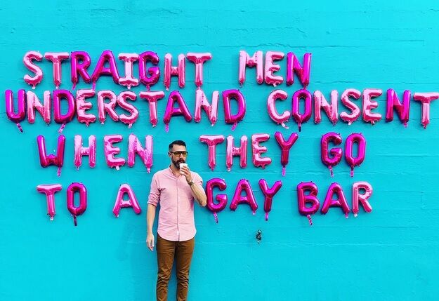 gay man giving the nod signal in a gay bar porn