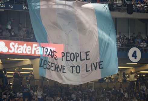 Activists unfurl huge banner supporting trans rights during World Series