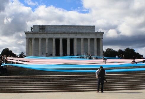 Activists unfurled a gigantic trans flag on the steps of the Lincoln Memorial