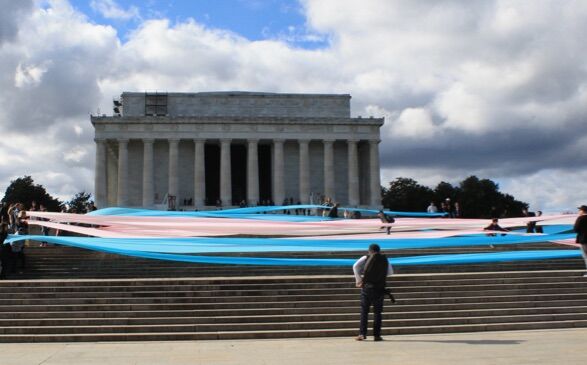Activists unfurled a 150-foot trans flag on the steps of the Lincoln Memorial to protest the Trump administration's attacks on transgender people.