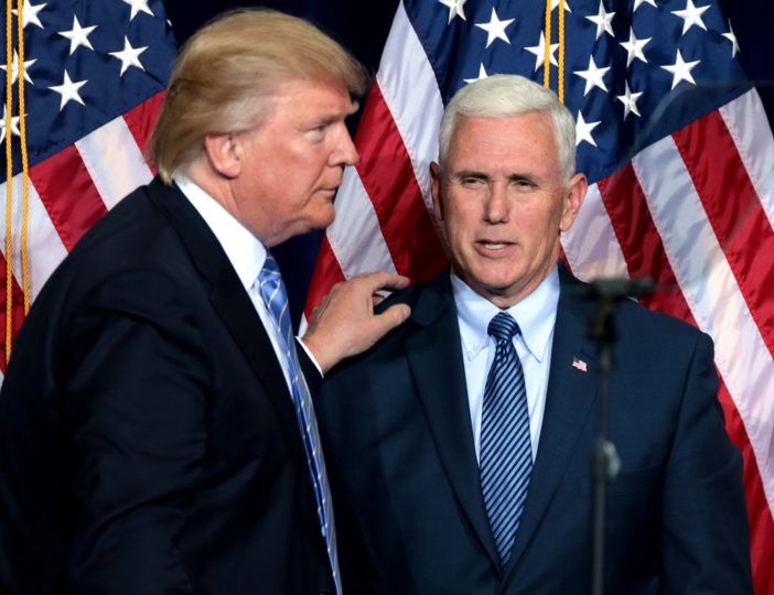 Donald Trump and Mike Pence in front of American flags