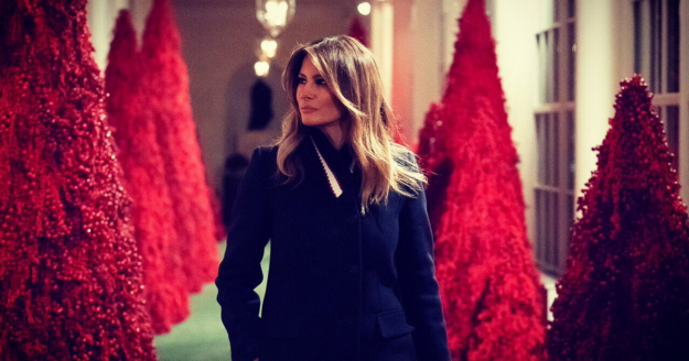 First Lady Melania Trump poses with this year's Christmas decorations.