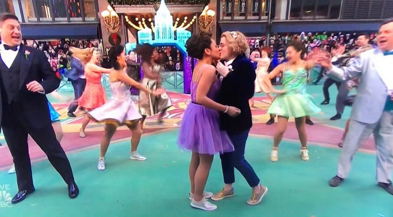The Prom stars Caitlin Kinnunen and Isabelle McCalla share a smooch during the Macy's Thanksgiving Day Parade.