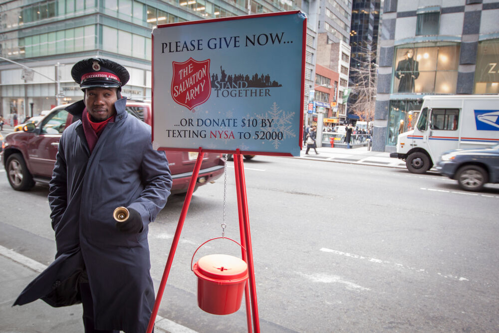December 22 2010: A Salvation Army soldier rings the bell for donations in midtown Manhattan during Christmas season.