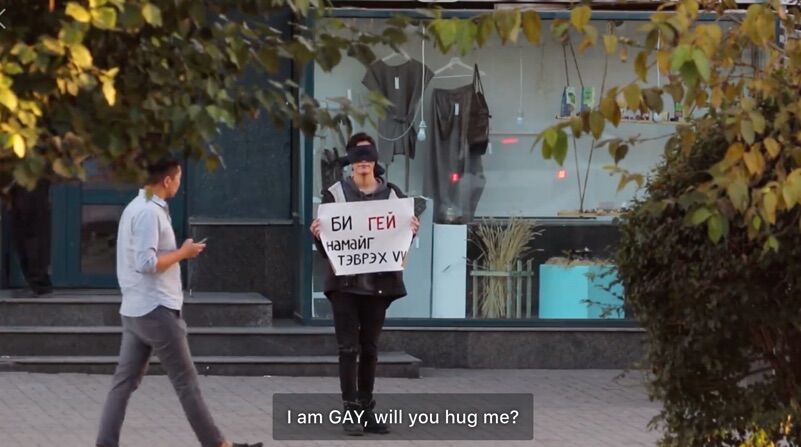 Three queer Mongolians stood outside blindfolded and asking for hugs. Would anyone stop?