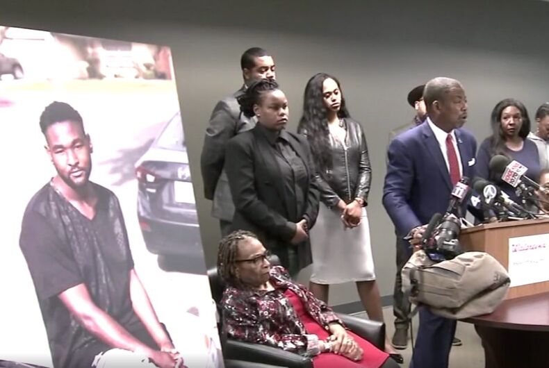jonathan-hart-walgreens A press conference with a lawyer at a lectern and the family of Jonathan Hart behind him. There is a large image of Jonathan Hart.