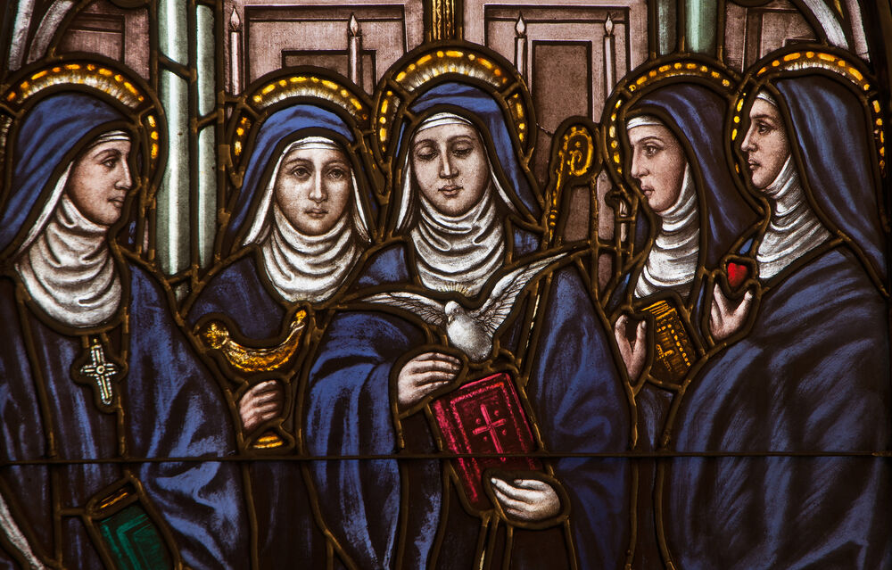 BRISTOW, VIRGINIA - APRIL 26, 2015: Stained glass window depicting five Benedictine female saints, Saints Hildegard, Walburga, Scholastica, Mechtild, and Gertrude, located at St. Benedict Monastery