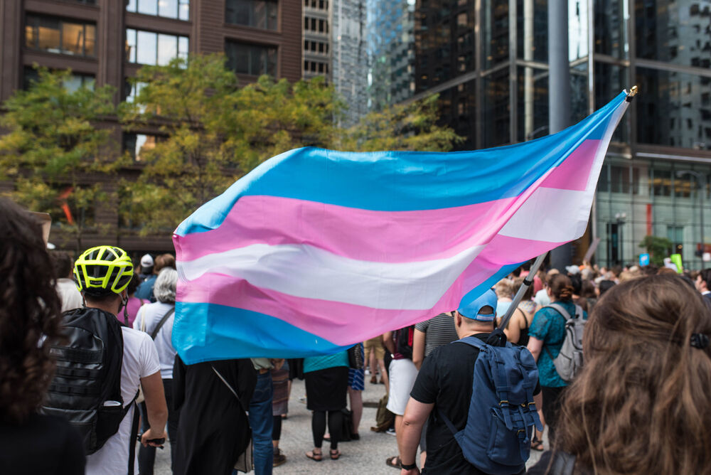 CHICAGO, ILLINOIS - AUGUST 21, 2017: Transgender pride flag waving in the wind during a protest against white supremacy and discrimination after the events in Charlottesville, Virginia.