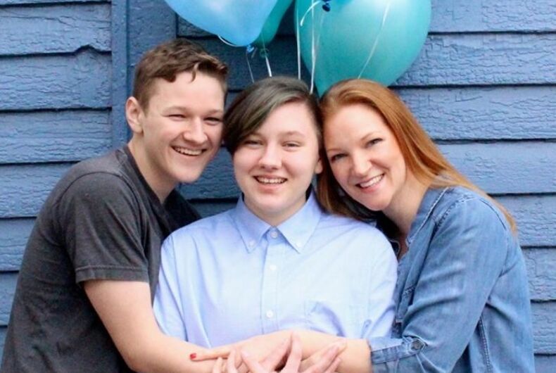 heather-green-main Green family in front of blue balloons