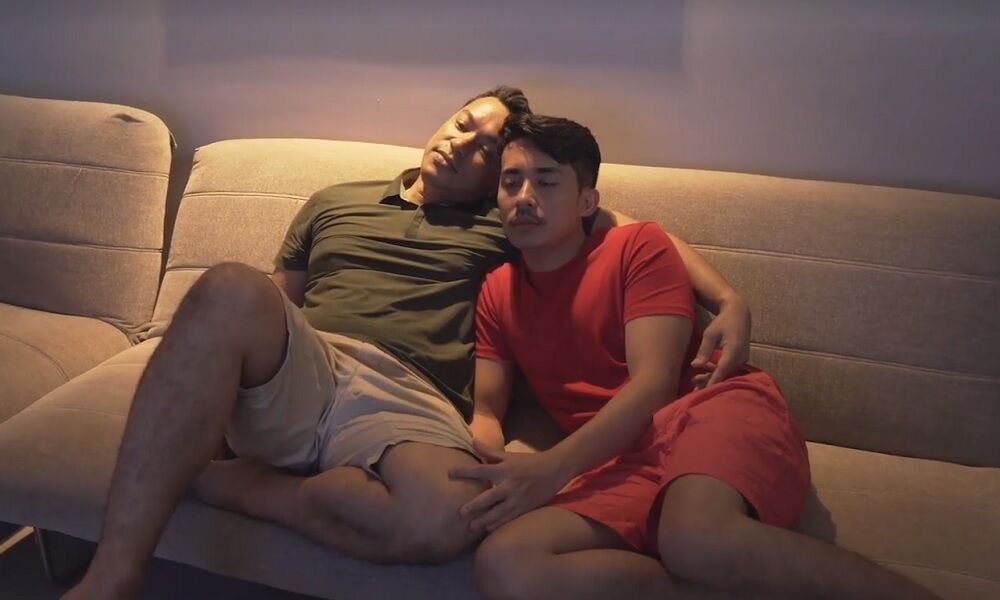 A Malaysian gay couple watching TV