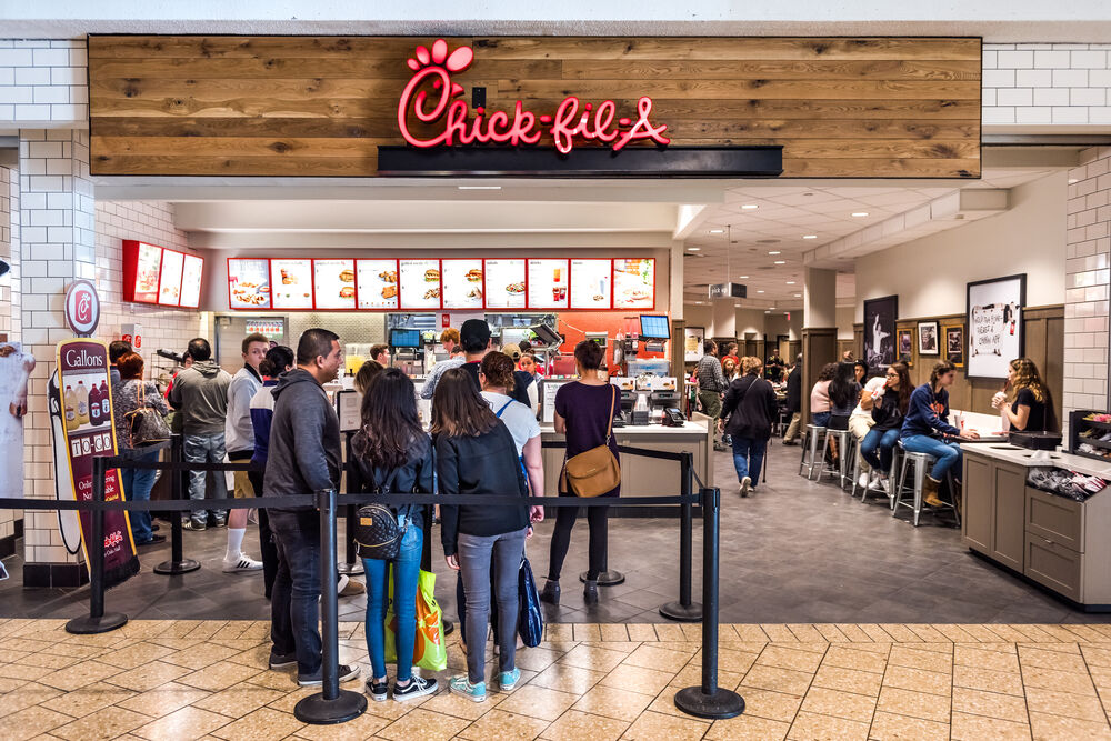 Fairfax, USA - February 18, 2017: Chick-fil-A store with people in line waiting to buy food