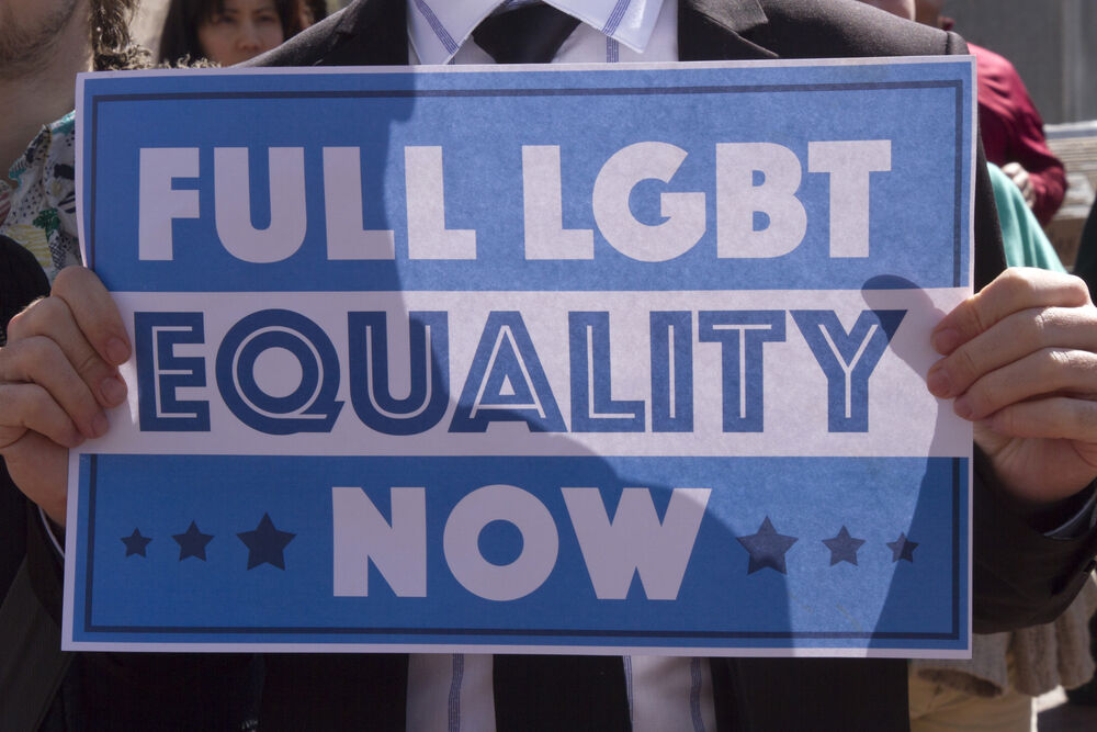 Asheville, NC - April 2, 2016: An activist holds a sign at a HB2 protest rally.