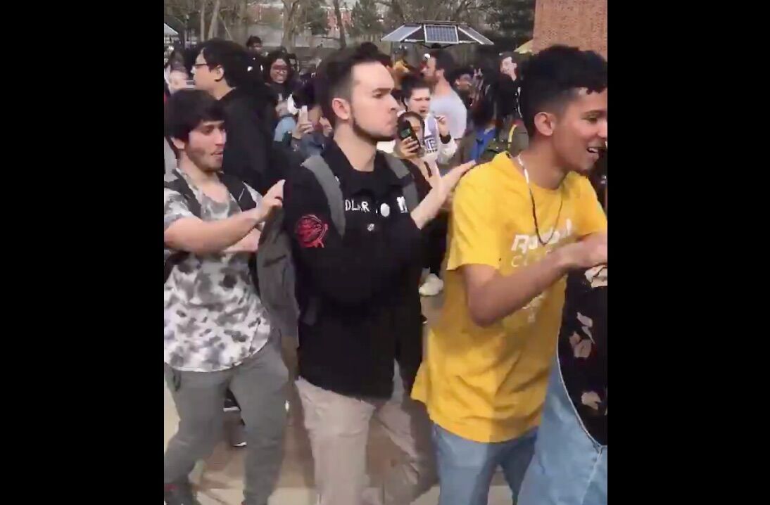 Students at Rowan University drowned out anti-LGBTQ protesters with a conga line dance party.