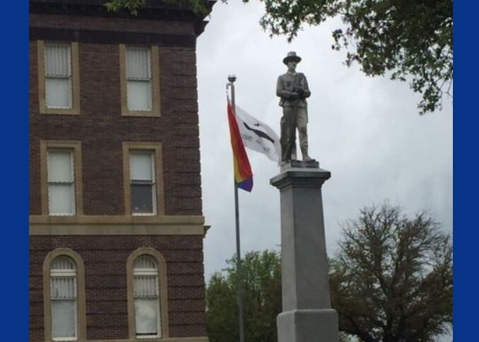 The rainbow flag flying outside the Mills County Courthouse