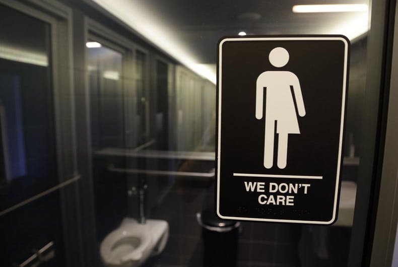 bathroom sign that says "We don't care."