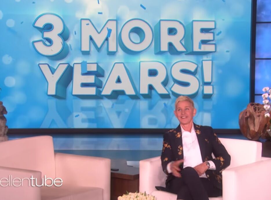 Ellen with a "3 more years!" sign behind her