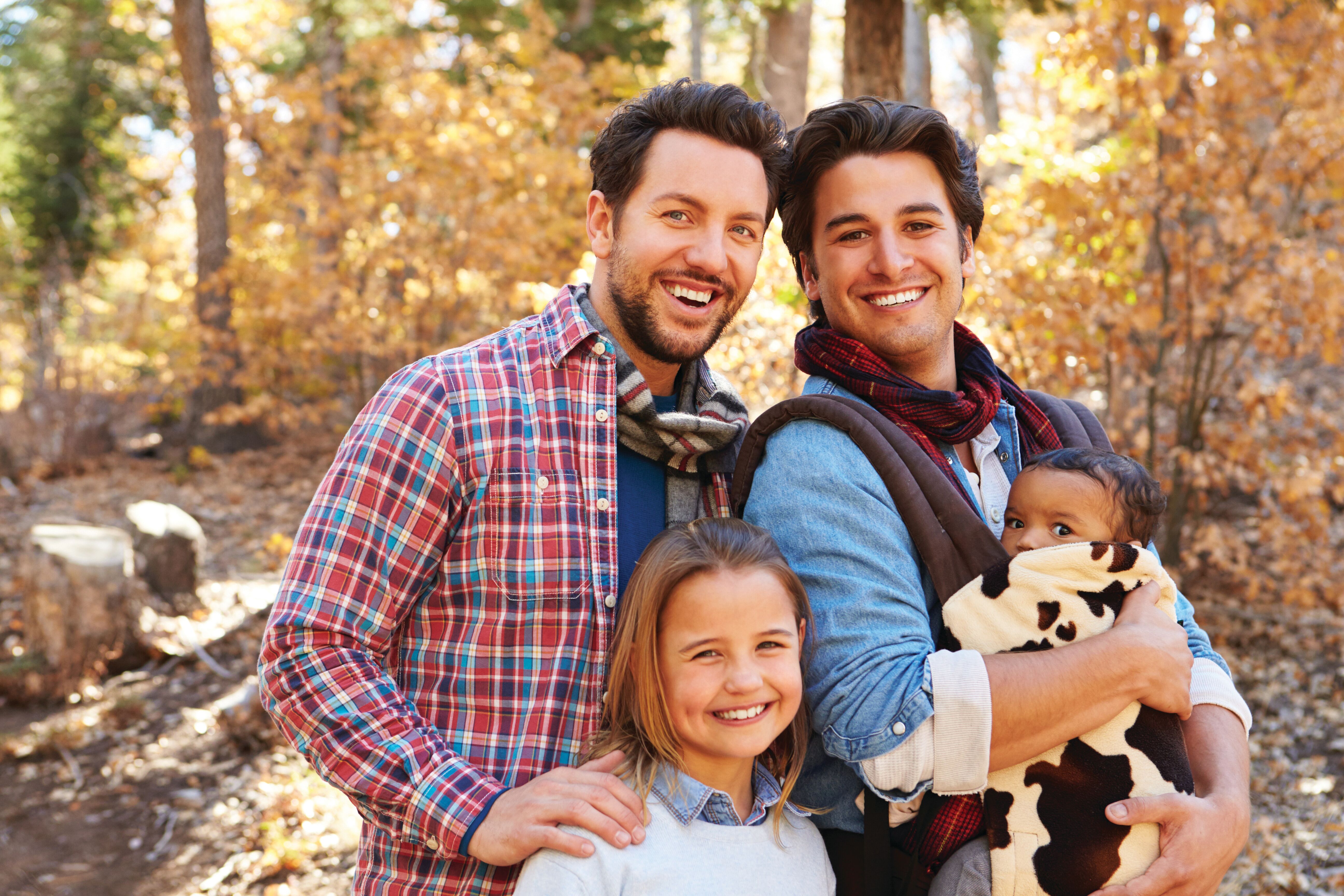 Gay Male Couple With Children in Fall Woodland