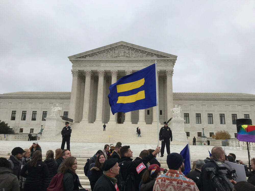Human Rights Campaign flag being waved at the Supreme Court on December 5, 2017