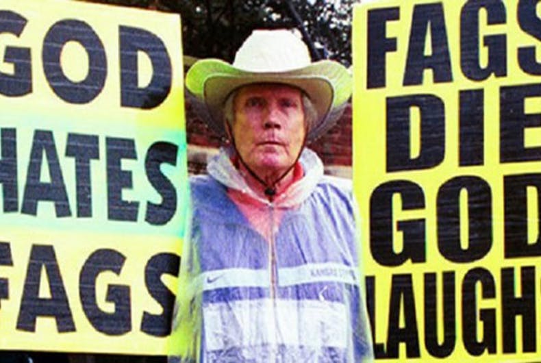 Westboro Baptist Church founder Fred Phelps holds his infamous signs