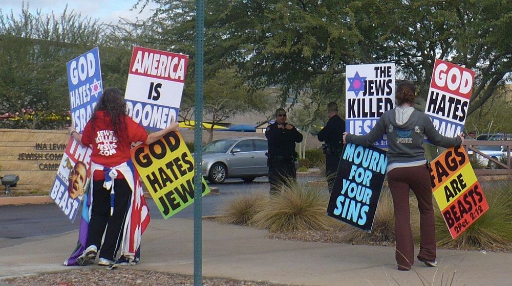 Westboro Baptist Church protestors with their signs