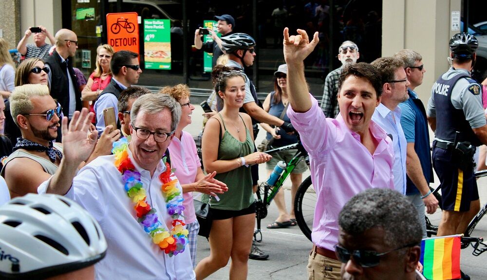 Mayor Jim Watson marches alongside Canadian Prime Minister Justin Trudeau at the 2017 Capital Pride Parade.
