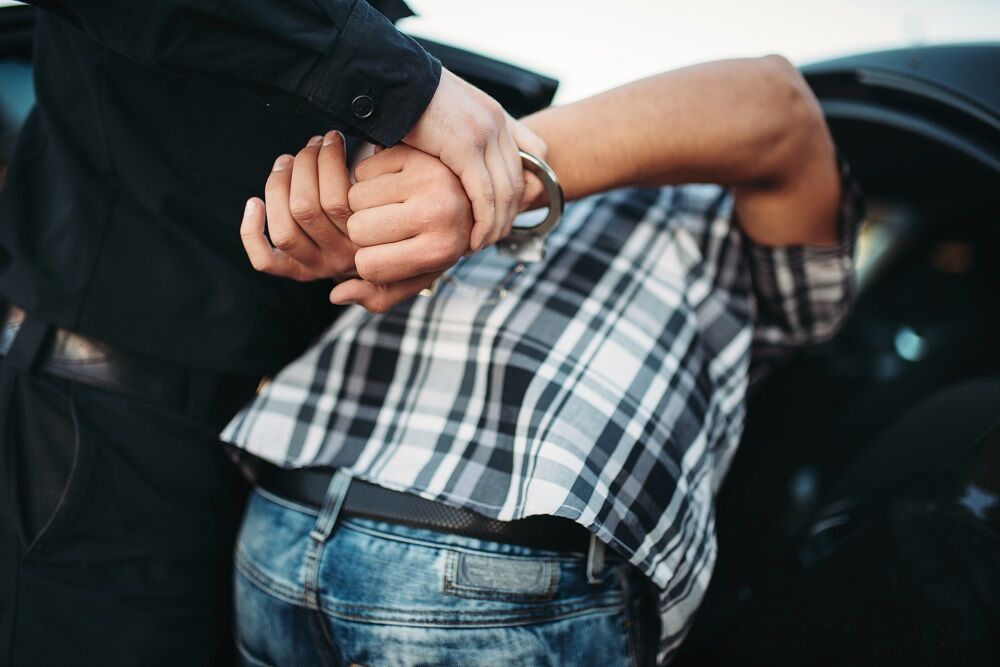 A stock image of a man being arrested