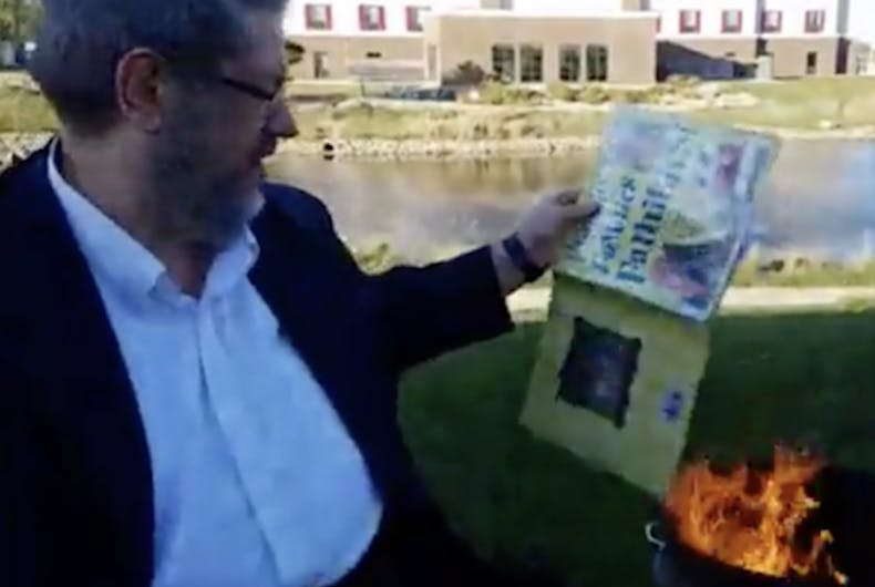 Paul Dorr burns a library book