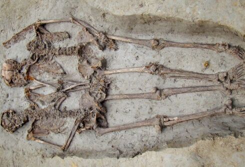 Two ancient skeletons were found holding hands. They were both men.