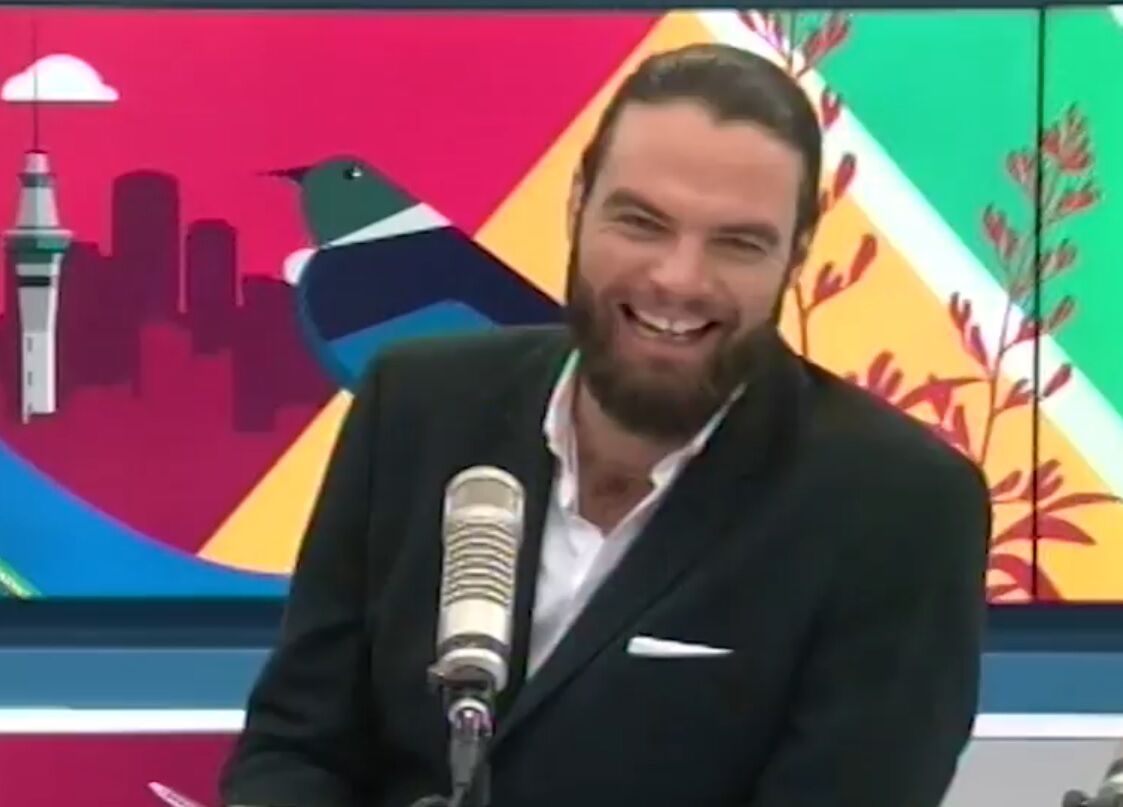 The AM Show host Ryan Bridge laughing nervously as he's outed on air.
