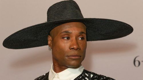 Billy Porter wears a wide brimmed black hat while serving some serious side eye.