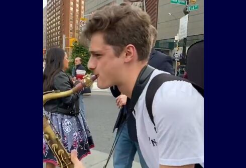 Street preacher’s hate speech drowned out by two music students with saxophones