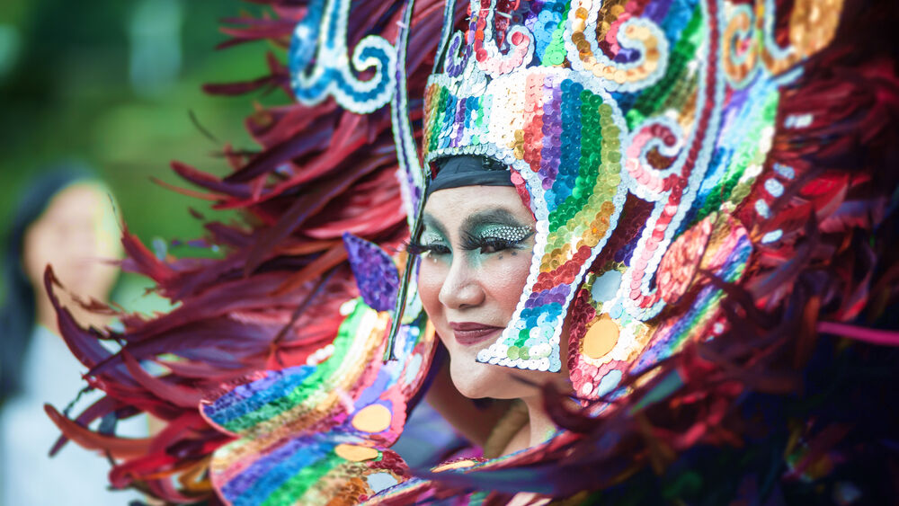 a performer wears a colorful sequin headdress at Sydney's Gay and Lesbian Mardi Gras