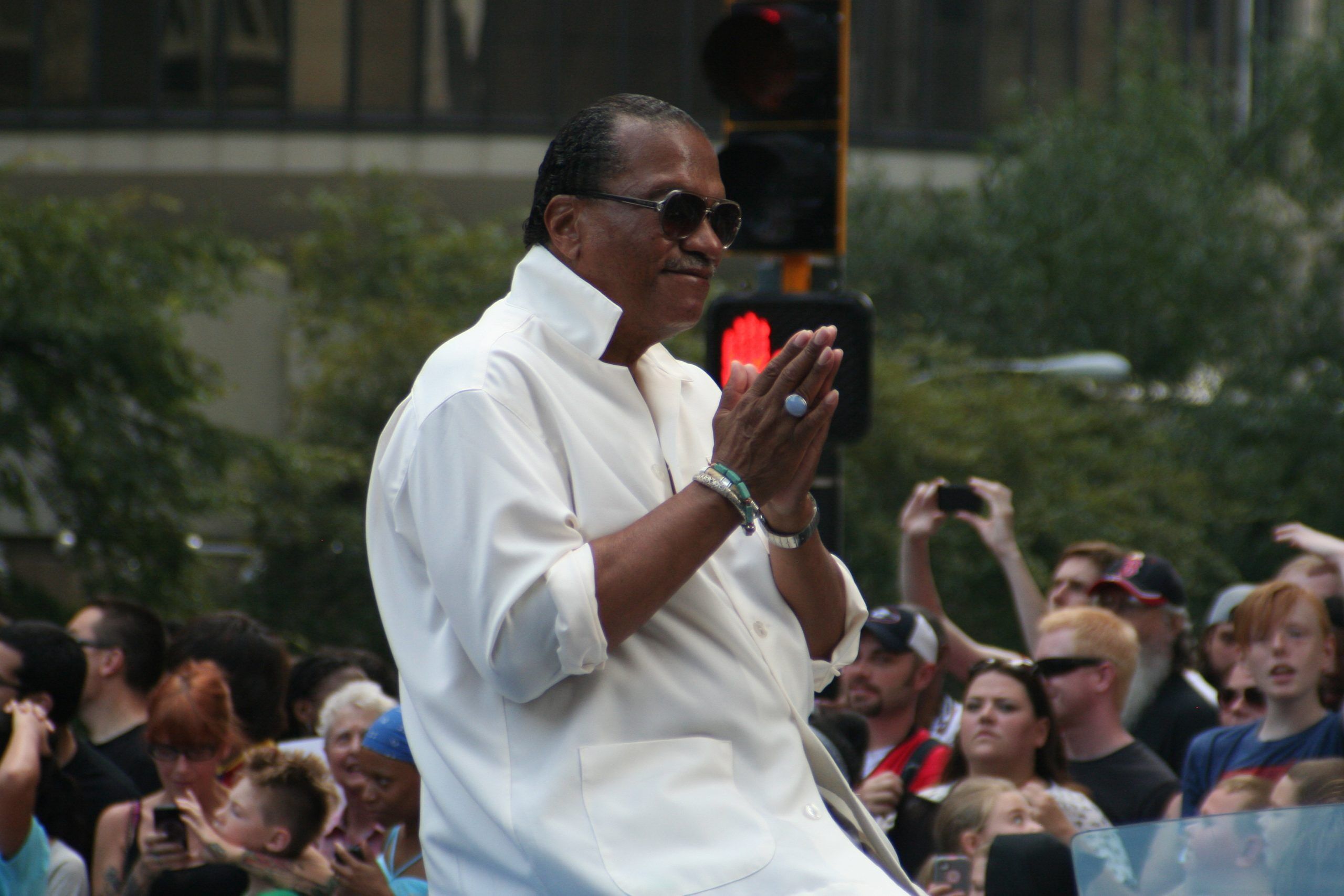 Billy Dee Williams, known for his role as Lando Calrissian in Star Wars, acknowledges the crowd at the annual DragonCon parade held August 31, 2013 in Atlanta.