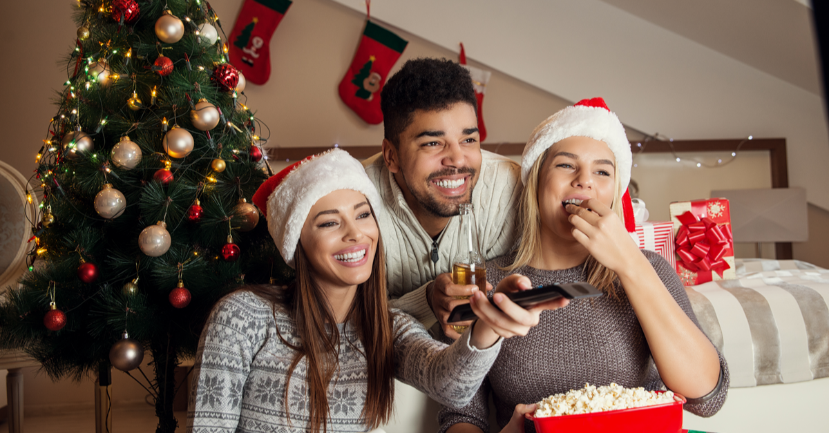 Friends watching movie and having fun at Christmas eve.